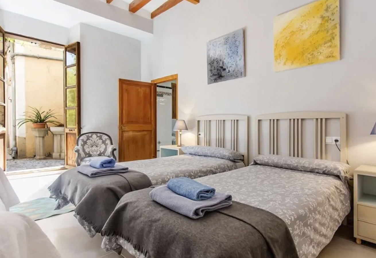 Bright twin room with high ceilings